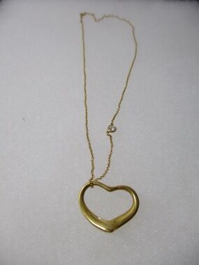 Tiffany & Co. Yellow Gold Heart Outline Pendant Necklace with bezel diamond
